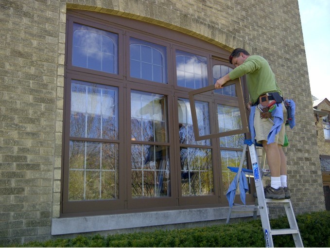 Man removing windows to clean