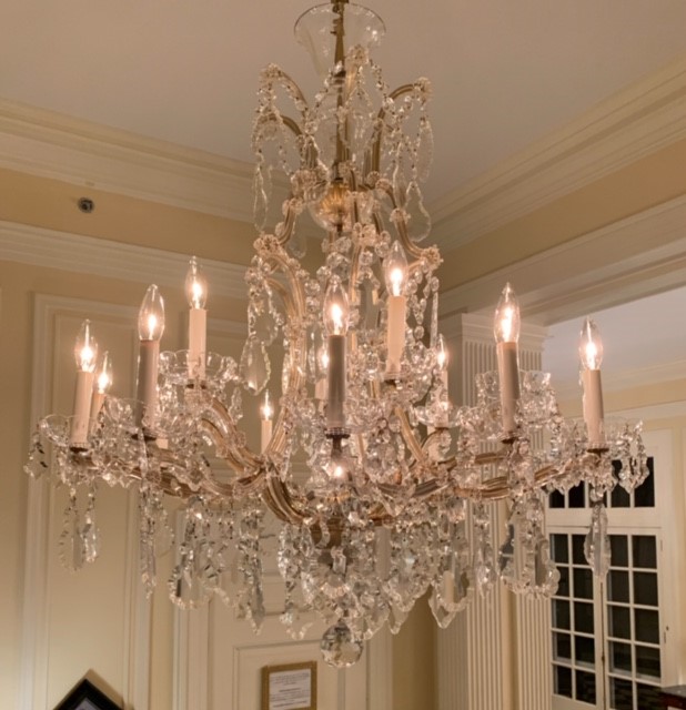 Cleaning chandeliers at the Duke Mansion